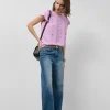 Blusa manga corta rosa con mini volantes en delantero