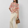 Blusón en gasa estampado vegetal floral tonos coral y rojo