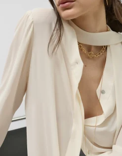 Blusón oversize cuello lazada crudo