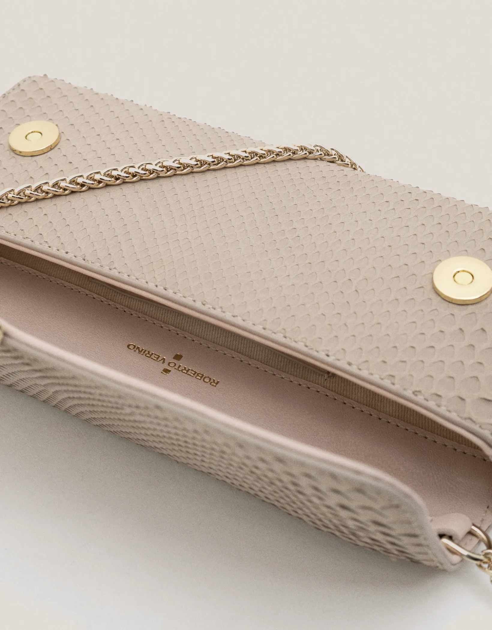 Bolso Clutch Ariana piel serpiente crudo