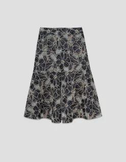 Falda midi tejido vaquero azul con bordado floral y calados