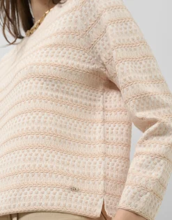 Jersey con intarsia geométrica cámel y crudo