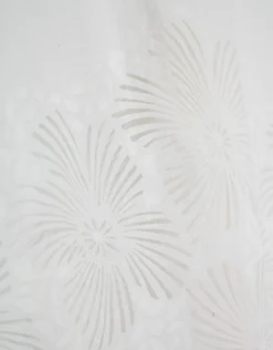 Pantalón palazzo con diseño floral en devoré blanco