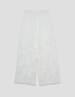 Pantalón palazzo con diseño floral en devoré blanco