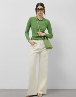Pantalón vaquero ancho beige con bordados florales