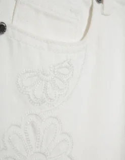 Pantalón vaquero ancho beige con bordados florales