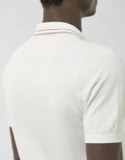 Polo tricotado blanco con rayas en cuello y puños
