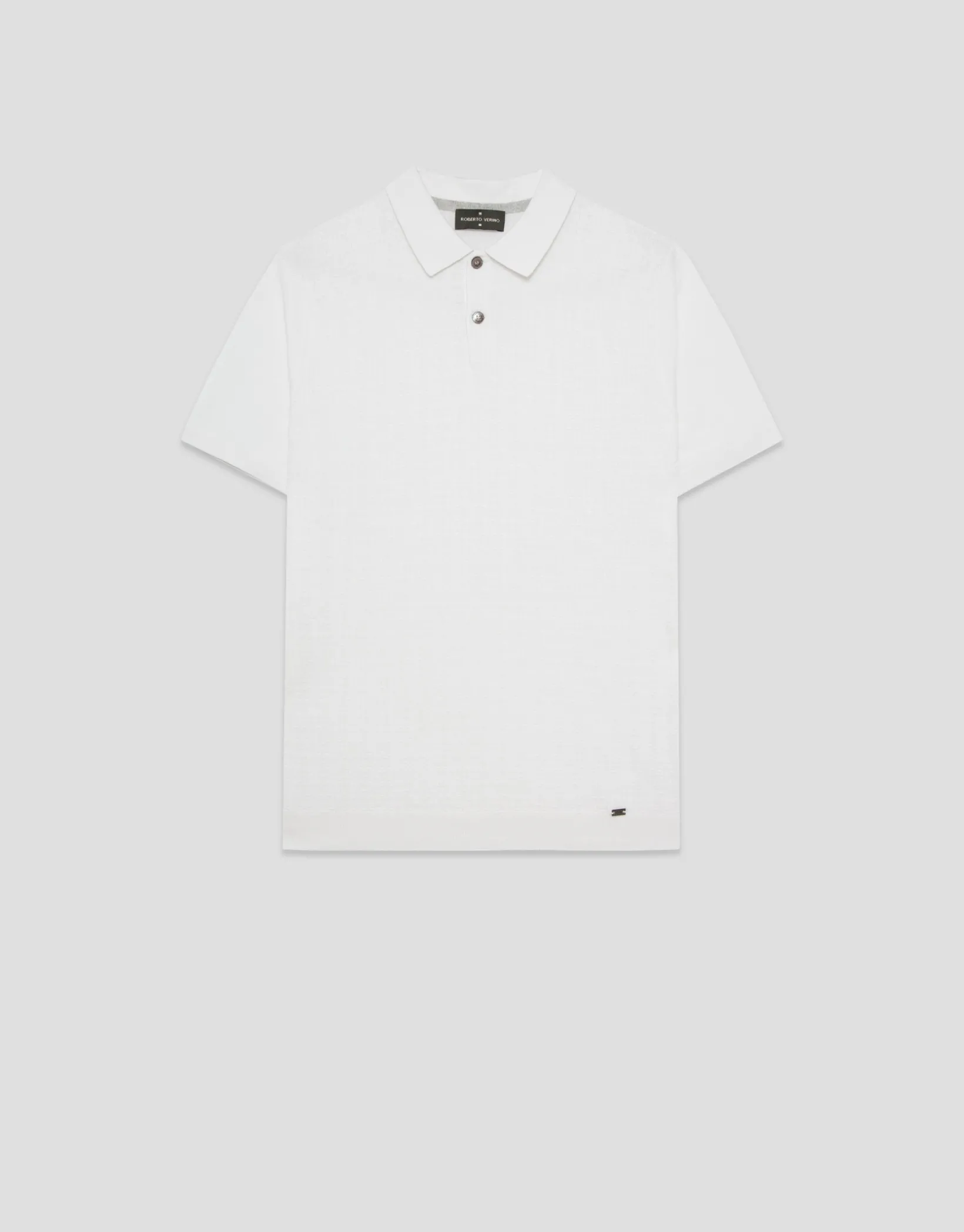 Polo tricotado blanco estructurado