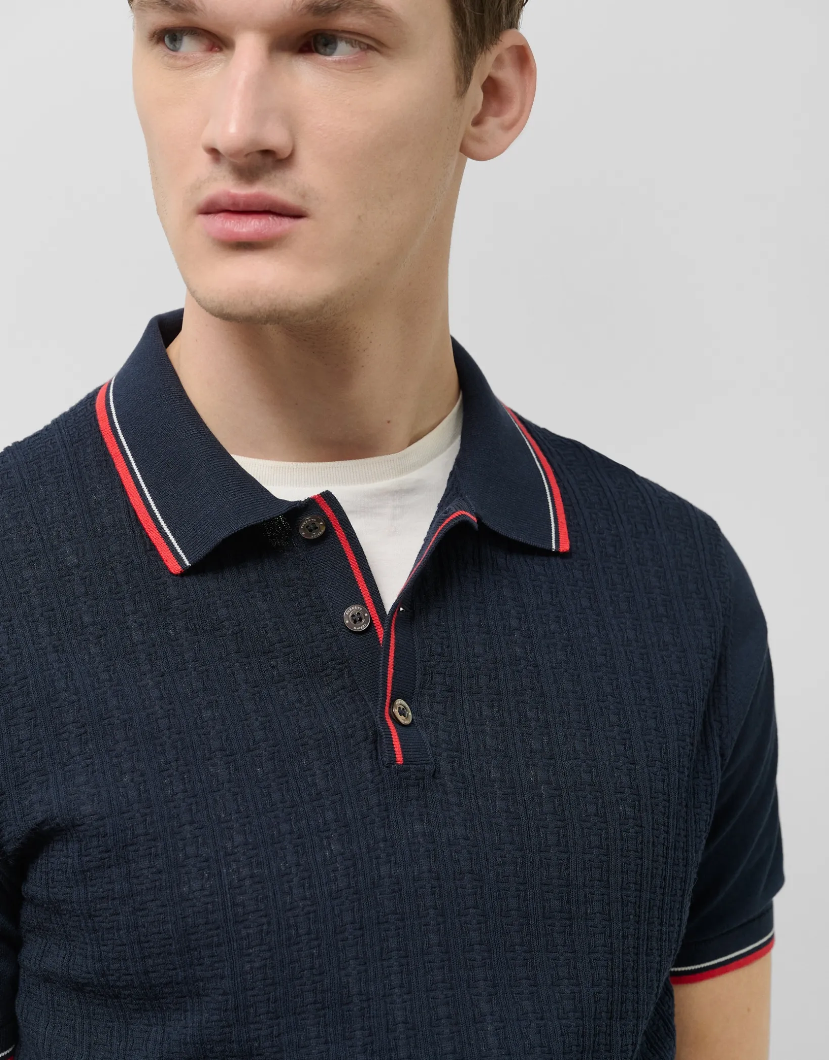 Polo tricotado marino estructura rayas