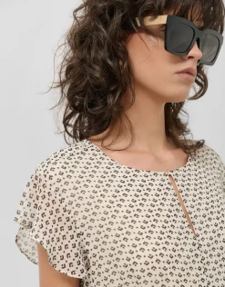 Vestido midi falda plisada estampado geométrico blanco y negro