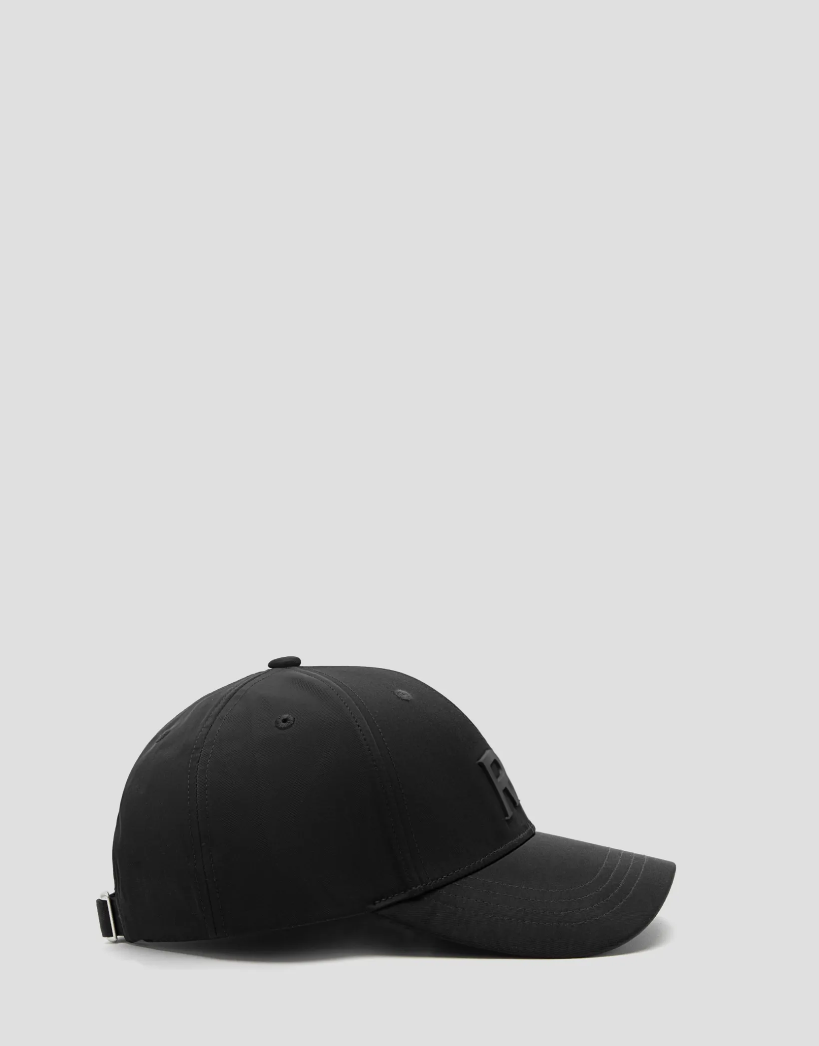Visera nailon negro con logo en relieve